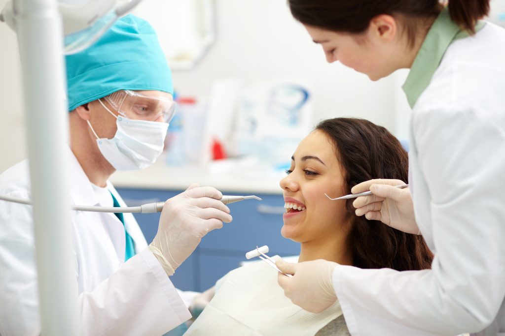 Signature Smiles Dental Group | Discover How Veneers Are Made – Transform Your Smile Today Signature Smiles Dental Group Dentists examining patients teeth for Veneers
