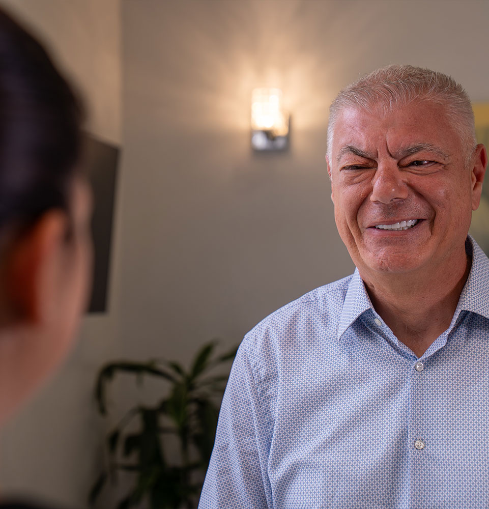 Patient smiling at team member