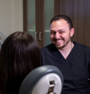 Doctor Smiling at Paitent