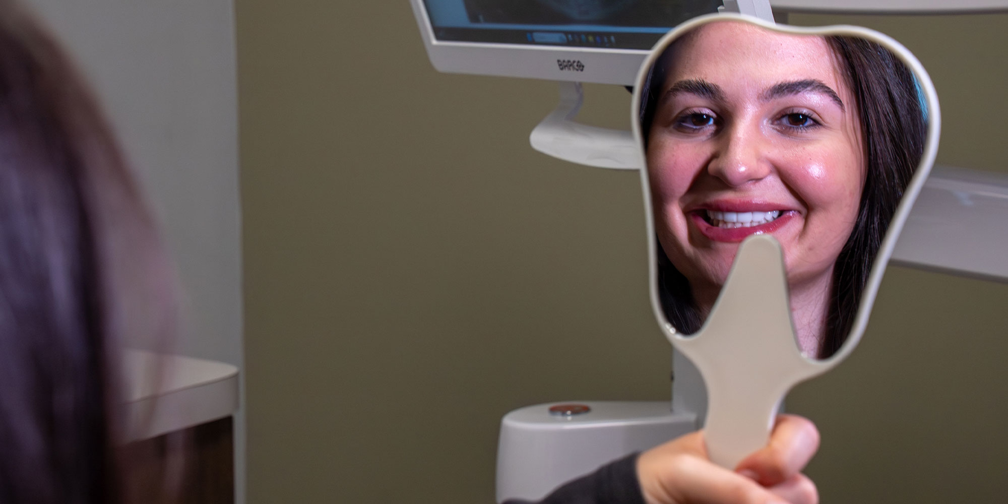 Paitent Smiling into mirror